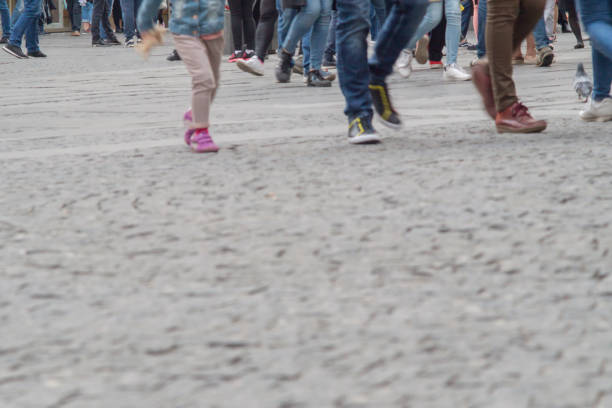 istock People walking through a pedestrian zone background 1200665688