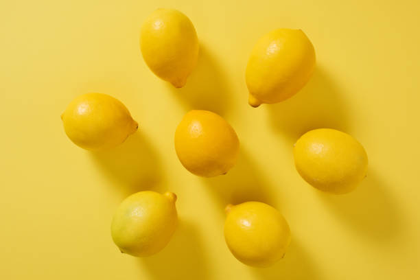 istock High Angle View Of Lemons Yellow Background 1200667770