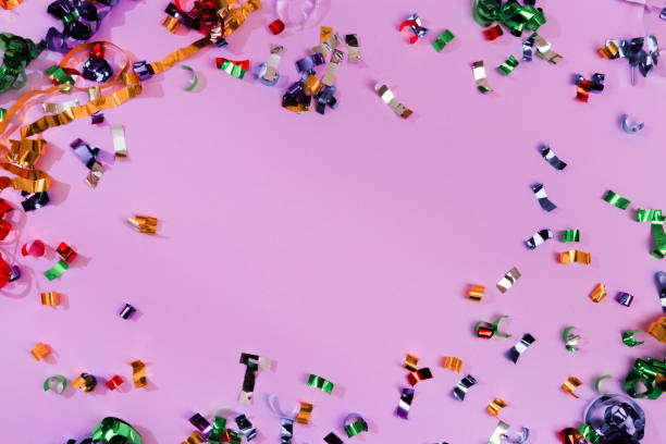 istock Colour sparkles on violet holiday background. Festive backdrop for your projects. 1200668543