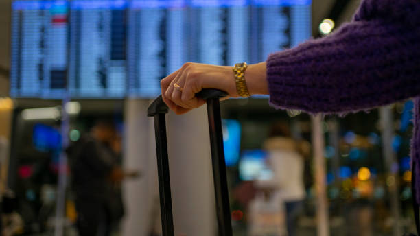 istock Woman Checking the Time of Flight 1200674058