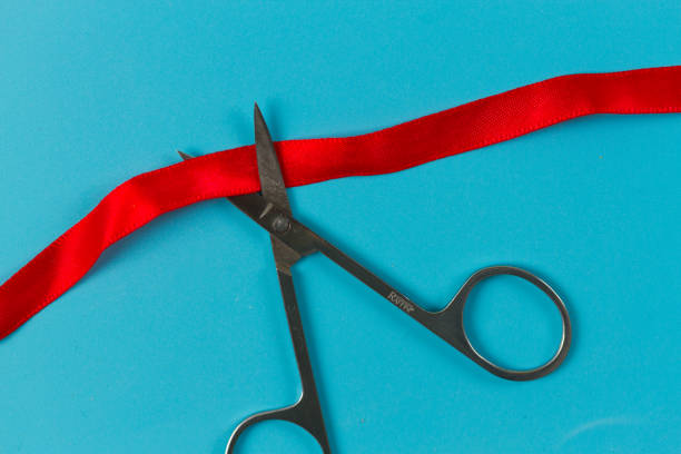 istock Red ribbon on blue background 1200675024