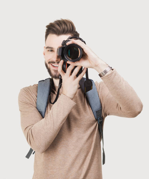 istock Young men photographer with dslr camera 1200677758