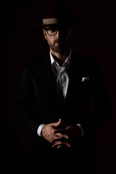 istock Pensive fashion model holding his hands together 1200679131
