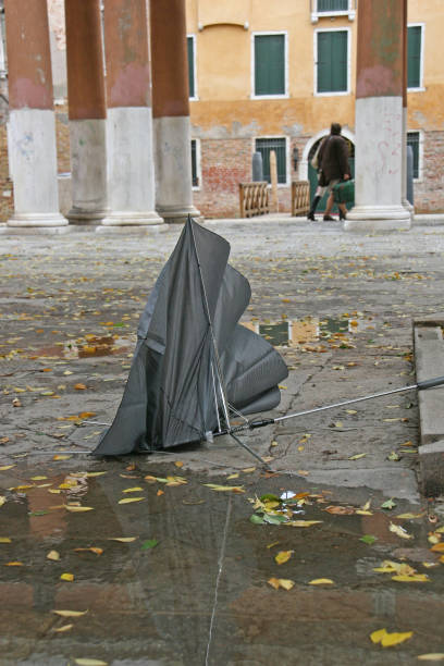 istock broken umbrella in street of Venice 1200679357