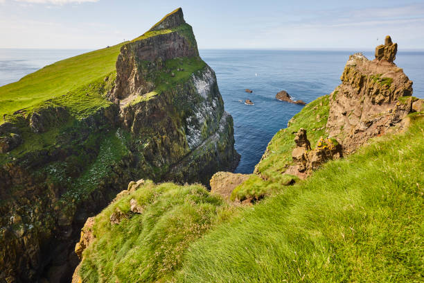istock Faroe islands green cliffs in Mykines island. Atlantic ocean 1200681269