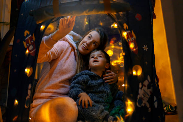 istock Mother and son playing in tent 1200682028