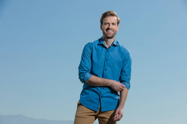 istock casual man standing and fixing sleeve happy 1200683399
