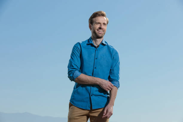 istock casual man standing and fixing sleeve happy 1200683423