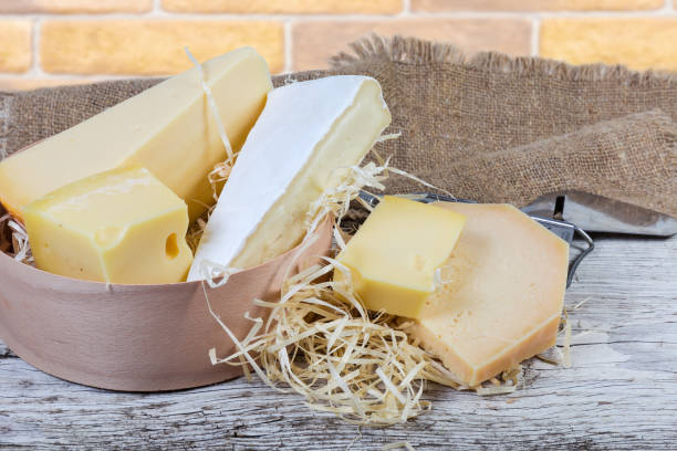 istock Different varieties of cheese on the old wooden surface 1200683601