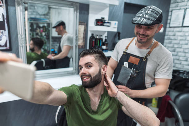 istock Young man making selfie after getting a nice haircut 1200684252