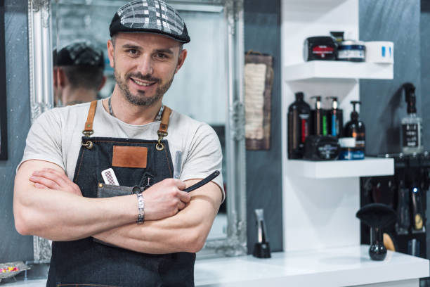 istock Professional coiffeur at his beauty salon 1200684260