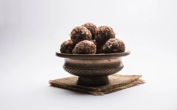 Aliv Laddu, Halim Ladoo or Garden cress Seed sweet Balls a very nutritious food in winters or for New Moms. popular food from India. served in a bowl or plate