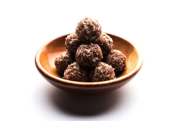Aliv Laddu, Halim Ladoo or Garden cress Seed sweet Balls a very nutritious food in winters or for New Moms. popular food from India. served in a bowl or plate