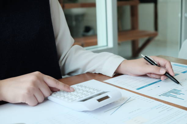 istock Business People Meeting Design Ideas  with pen analyzing financial documents professional investor working new start up project. Concept. business planning in office. 1200687151