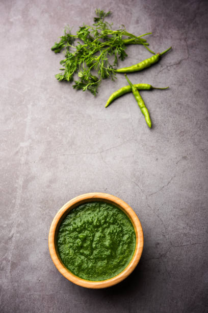 istock Kothimbir or Dhaniya Chutney made using Cilantro or coriander with chilli, served in a bowl. selective focus 1200687417