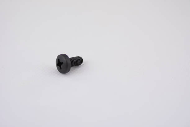 black screw isolated and with focus on the screw-in body - bolt nut screw hardware store imagens e fotografias de stock