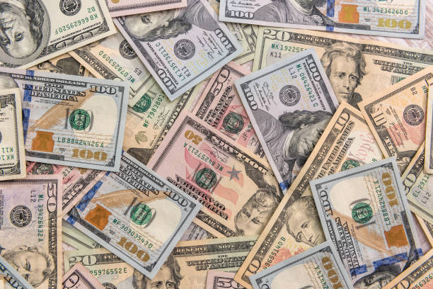istock American paper dollar bills as background 1200690438