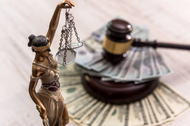 istock Themis statue standing against the background of dollars 1200693081