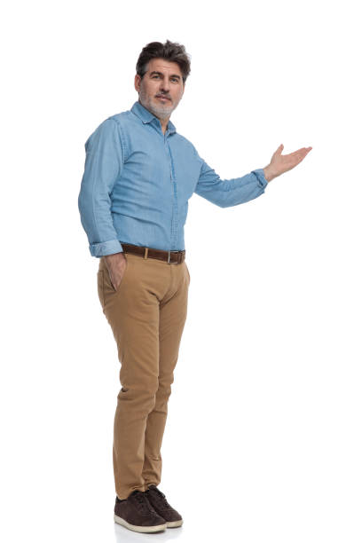 istock Smart casual man presenting with his hand in his pocket 1200693195
