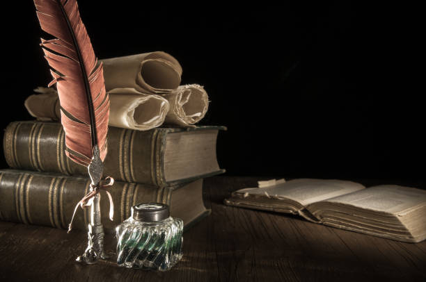 istock Quill pen and old books 1200695255