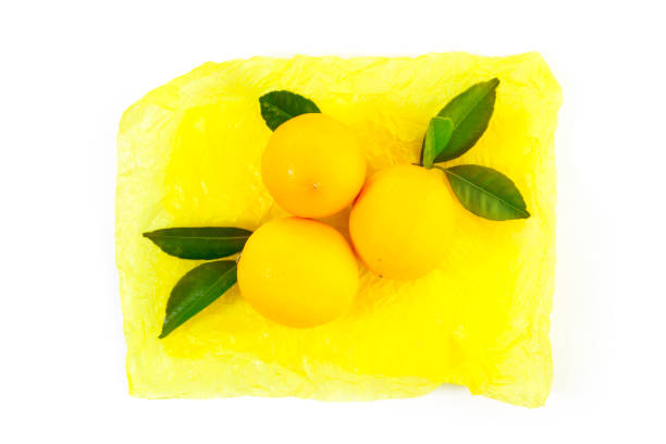 fresh yellow lemons on a colorful package paper