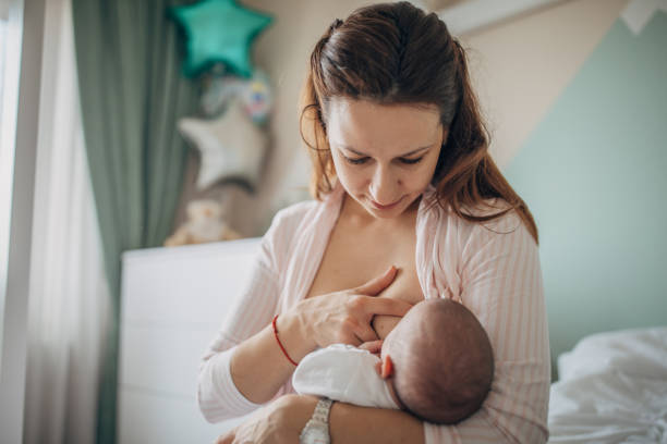 istock Mother breastfeeding her baby boy at home 1200696077