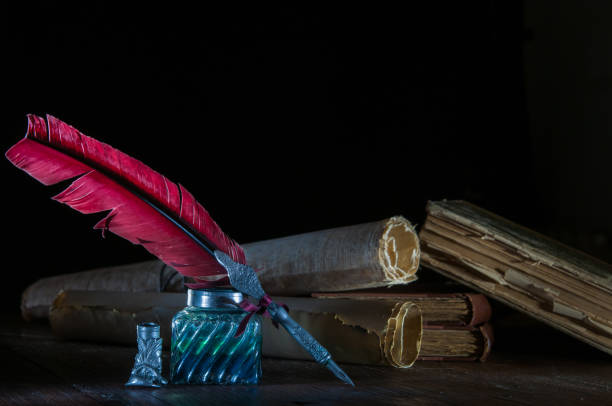 istock Quill pen and old books 1200696769