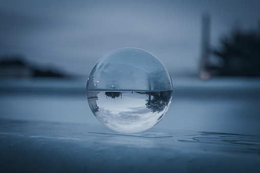 crystal sphere, ball-shaped lens at the edge of the pool