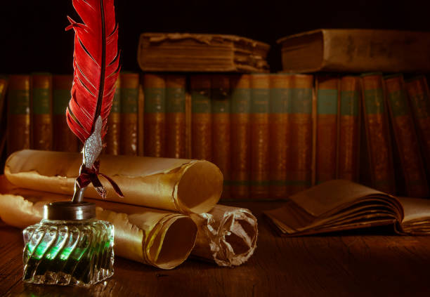 istock Quill pen and old books 1200699054