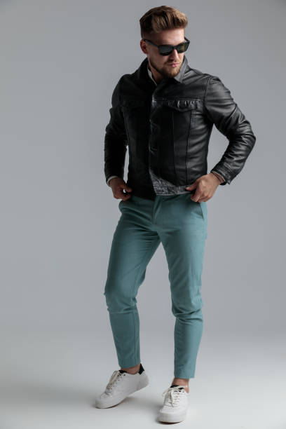 istock sexy young model wearing leather jacket and sunglasses 1200699195