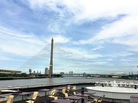 Somdet Phra Pinklao Bridge's view from a restaurant ferry on Chao Phraya river, Bangkok, Thailand