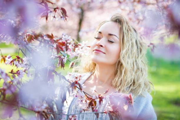 istock Young woman enjoying the nature in spring 1200699871