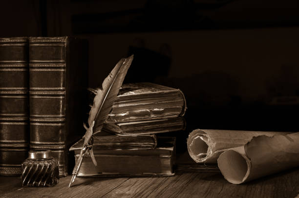 istock Quill pen and old books 1200700871