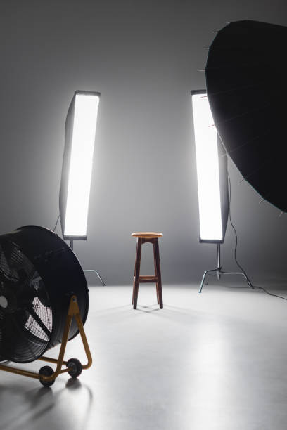fan, reflector, wooden stool and lights on backstage in photo studio fan, reflector, wooden stool and lights on backstage in photo studio backstage photos stock pictures, royalty-free photos & images
