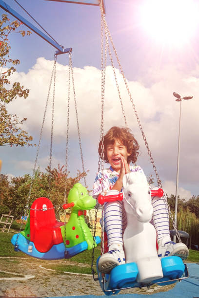 istock Happy smiley Little kid having fun on playground. 1200701127
