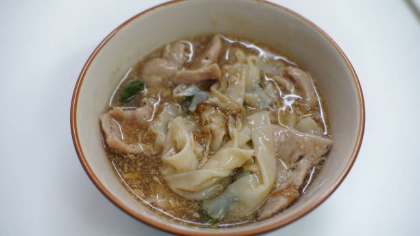 istock noodles in gravy pork, fried eggs and vegetables 1200701342