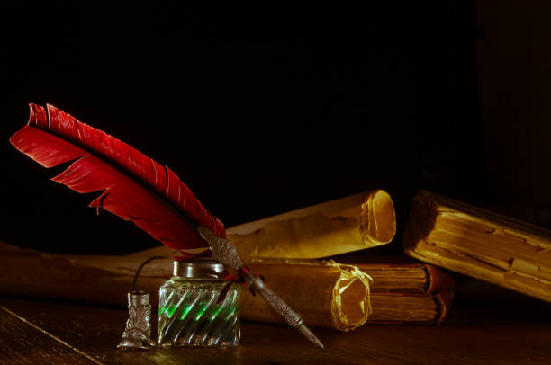 istock Quill pen and old books 1200701440