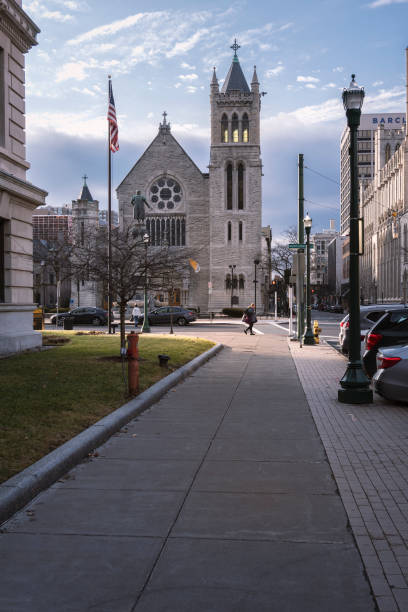 SYRACUSE, NEW YORK - JAN 14, 2020: Normal View of Columbus Circle in Foreground and Cathedral of Immaculate Conception and NYS Environmental Protection Fund in Syracuse, New York.