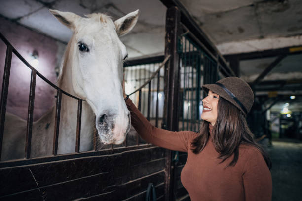 istock Beautiful woman in barn 1200702168