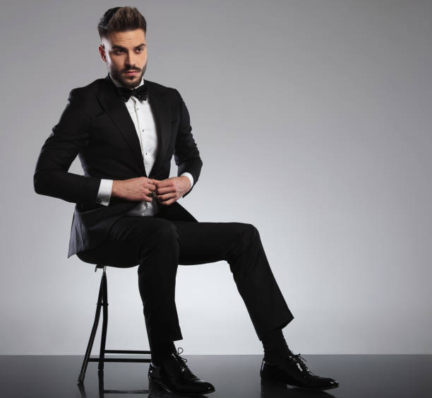 istock Nervous model unbuttoning his shirt and looking away 1200702173
