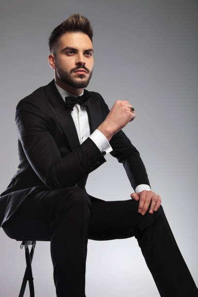istock Thoughtful groom looking away while wearing tuxedo 1200702245