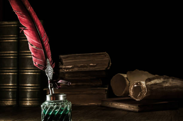 istock Quill pen and old books 1200702337