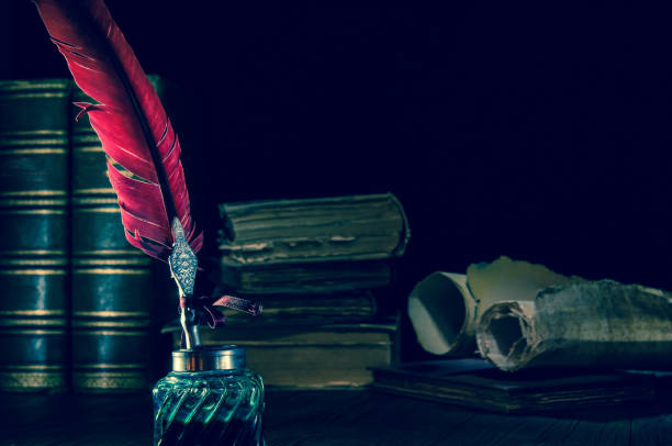 istock Quill pen and old books 1200702442