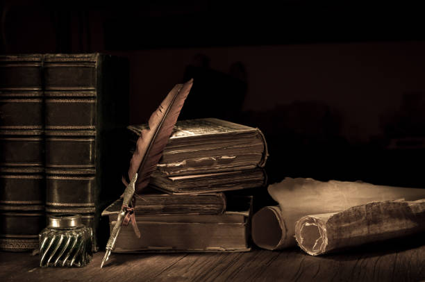 istock Quill pen and old books 1200702519