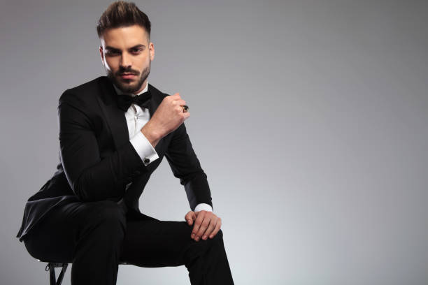 istock Tough elegant model looking forward with his fist clenched 1200702948