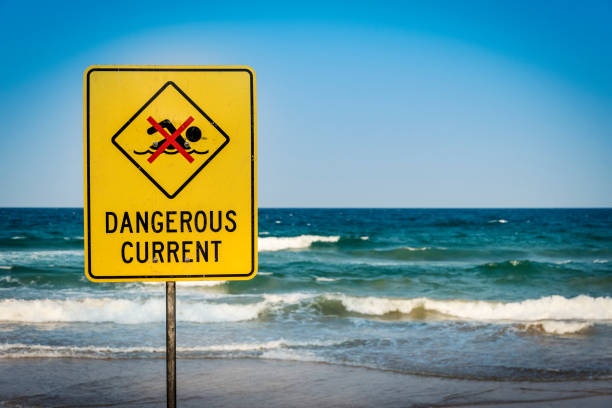 istock Warning sign for swimmers to beware dangerous currents 1200704326