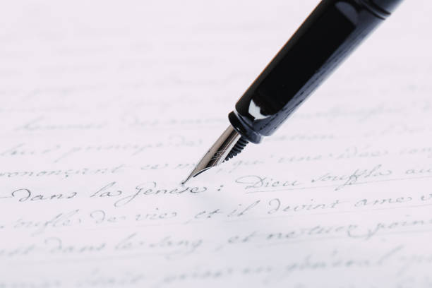istock fountain pen on paper with ink text closeup 1200705282