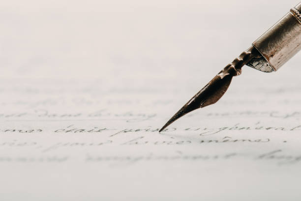 istock fountain pen on paper with ink text closeup 1200705283
