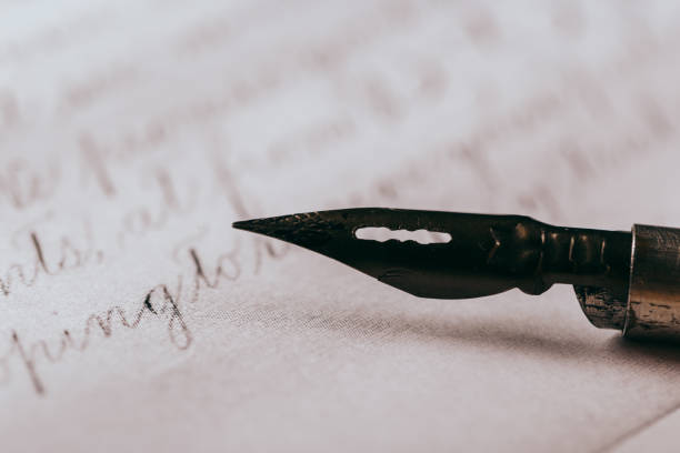 istock fountain pen on paper with ink text closeup 1200705299