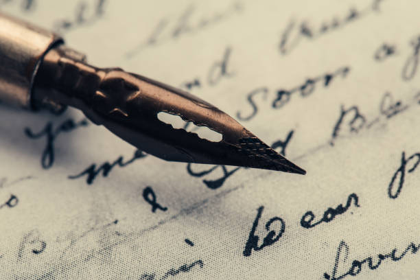istock fountain pen on paper with ink text closeup 1200705303